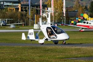 Commercial plane at airport and airfield. Small and sport aircraft. General aviation industry. Vip transport. Civil utility transportation. Fly and flying. photo