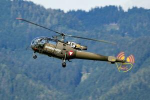 Military helicopter at air base. Air force flight operation. Aviation and aircraft. Air defense. Military industry. Fly and flying. photo