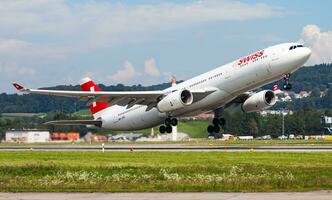 Swiss International Airlines passenger plane at airport. Schedule flight travel. Aviation and aircraft. Air transport. Global international transportation. Fly and flying. photo