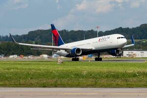 Delta Airlines passenger plane at airport. Schedule flight travel. Aviation and aircraft. Air transport. Global international transportation. Fly and flying. photo