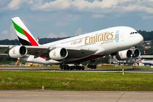 Emirates Airlines passenger plane at airport. Schedule flight travel. Aviation and aircraft. Air transport. Global international transportation. Fly and flying. photo
