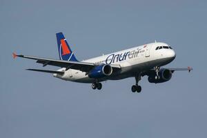 Onur Air Airbus A320 TC-OBU passenger plane arrival and landing at Istanbul Ataturk Airport photo