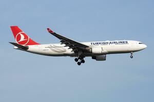 Turkish Airlines Airbus A330-200 TC-LNA passenger plane landing at Istanbul Ataturk Airport photo