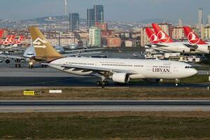 Libyan Airlines Airbus A330-200 5A-LAT passenger plane departure at Istanbul Ataturk Airport photo