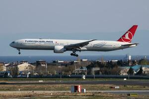 Turkish Airlines Boeing 777-300ER TC-LJC passenger plane landing at Istanbul Ataturk Airport photo