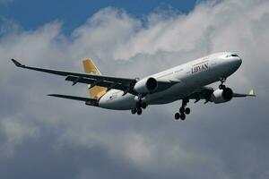 Libyan Airlines Airbus A330-200 5A-LAT passenger plane arrival and landing at Istanbul Ataturk Airport photo