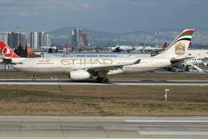 Etihad Airways Airbus A330-200 A6-EYG passenger plane departure at Istanbul Ataturk Airport photo