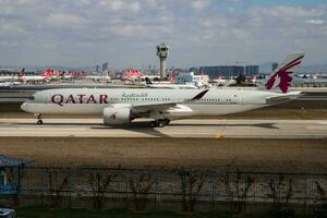 Qatar Airways Airbus A350-900 A7-ALI passenger plane departure at Istanbul Ataturk Airport photo