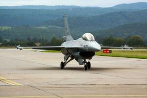 Military fighter jet plane at air base. Air force flight operation. Aviation and aircraft. Air defense. Military industry. Fly and flying. photo