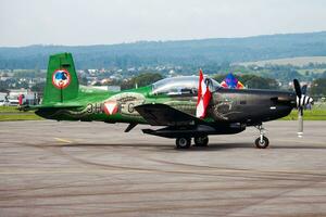 Military trainer plane at air base. Air force flight operation. Aviation and aircraft. Air defense. Military industry. Fly and flying. photo