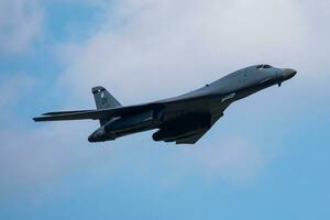 B-1 Military bomber jet plane at air base. Strategic air force flight operation. Aviation and aircraft. Air defense. Military industry. Fly and flying. photo