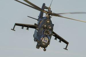 Military helicopter at air base. Air force flight operation. Aviation and aircraft. Air defense. Military industry. Fly and flying. photo