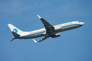 Xiamen Airlines passenger plane at airport. Schedule flight travel. Aviation and aircraft. Air transport. Global international transportation. Fly and flying. photo