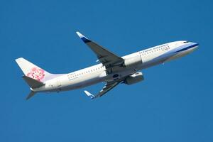 China Airlines passenger plane at airport. Schedule flight travel. Aviation and aircraft. Air transport. Global international transportation. Fly and flying. photo