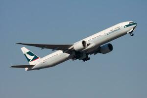 Cathay Pacific Airways Boeing 777-300ER B-KPA passenger plane departure and take off at Hong Kong Chek Lap Kok Airport photo