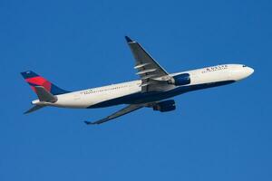 Delta Airlines Airbus A330-300 N810NW passenger plane departure and take off at Hong Kong Chek Lap Kok Airport photo