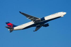 Delta Airlines Airbus A330-300 N810NW passenger plane departure and take off at Hong Kong Chek Lap Kok Airport photo