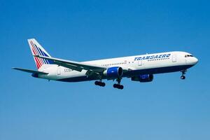 Transaero passenger plane at airport. Schedule flight travel. Aviation and aircraft. Air transport. Global international transportation. Fly and flying. photo