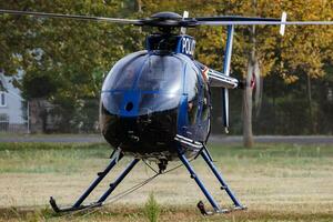 Government Police helicopter at mission. Police flight operation. Aviation and aircraft. Air policing. Aviation industry. Fly and flying. photo