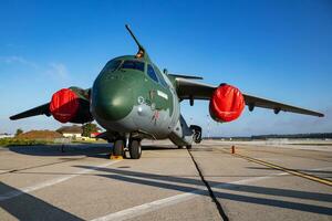 Embraer KC-390 Millennium. Military transport plane at air base. Air force flight operation. Aviation and aircraft. Air lift. Military industry. Fly and flying. photo