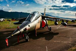 Military trainer plane at air base. Air force flight operation. Aviation and aircraft. Air defense. Military industry. Fly and flying. photo