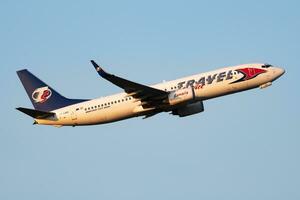 Travel Service Boeing 737-800 HA-LKG passenger plane departure and take off at Vienna Airport photo