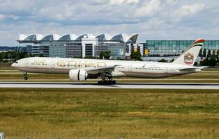 Etihad Airways Boeing 777-300ER A6-ETK passenger plane arrival and landing at Munich Airport photo