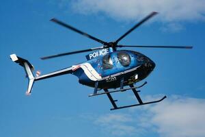 Hungarian government police helicopter at airport and airfield. Rotorcraft. General aviation industry. Police utility transportation. Air transport. Fly and flying. photo