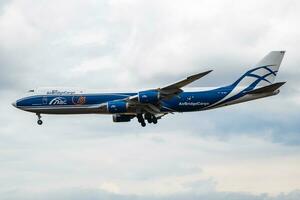 AirBridgeCargo cargo plane at airport. Air freight shipping. Aviation and aircraft. Air transport. Global international transportation. Fly and flying. photo