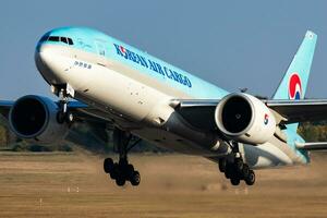 Korean Air Cargo Boeing 777-200 cargo plane at airport. Air freight and shipping. Aviation and aircraft. Transport industry. Transportation. Fly and flying. photo