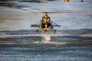 Hungarian Air Force Mil Mi-17 military transport helicopter. Flight operation and airlift. Aviation industry and rotorcraft. Fly and flying. photo