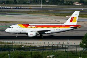 Iberia Airlines passenger plane at airport. Schedule flight travel. Aviation and aircraft. Air transport. Global international transportation. Fly and flying. photo