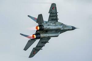 Military fighter jet plane at air base. Air force flight operation. Aviation and aircraft. Air defense. Military industry. Fly and flying. photo