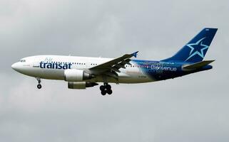 Air Transat passenger plane at airport. Schedule flight travel. Aviation and aircraft. Air transport. Global international transportation. Fly and flying. photo