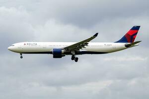 Delta Airlines Airbus A330-300 N808NW passenger plane arrival and landing at Amsterdam Schipol Airport photo