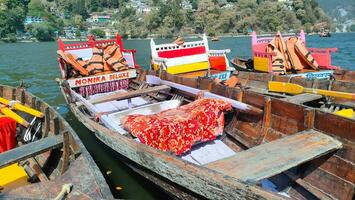 boats on lake dhaulagiri, manali, india photo