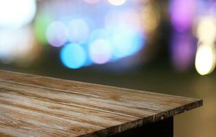 Empty wooden table in front of abstract blurred background of coffee shop . can be used for display or montage your products.Mock up for display of product photo