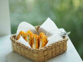 Chicken Cordon Bleu in Wicker basket, food on table photo