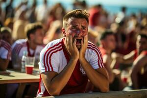 Sad Belarusian beach soccer fans photo