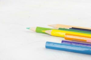 Color pencils isolated on white background. negative space. selective focus photo