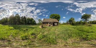 full seamless spherical hdri 360 panorama view near abandoned overgrown barn with bushes wooden house in village in forest in equirectangular projection, ready AR VR virtual reality content photo