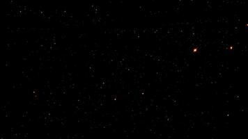 Loop orange red stars particles animation on black background video