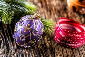 Christmas Time. Luxury golden purple blue christmas ball and decoration.Red ribbon with text happy christmas photo