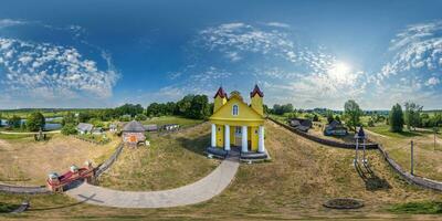 full hdri 360 panorama aerial view on wooden neo gothic catholic church in countryside or village in equirectangular projection with zenith and nadir. VR  AR content photo