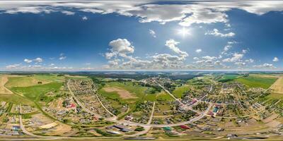 aerial hdri 360 panorama view over provincial town from great height at evening in equirectangular seamless spherical  projection. may use like sky replacement for drone 360 panorama photo