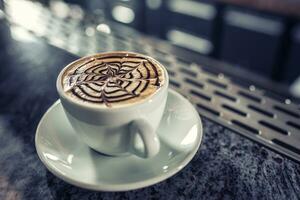 Coffee art artistic pattern on latte or cappuccino photo