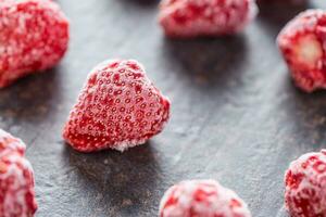 Close-up frozen strawberries covered by frost. photo