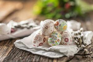 Handmade colorful easter eggs on a linen napkin. photo