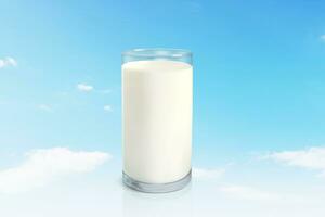 Milk in glass against bright sky background photo