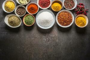 Set of variety aromatic spices and herbs in bowls photo